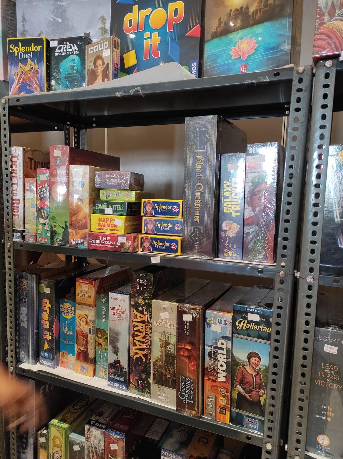Shelf stacked with boardgames